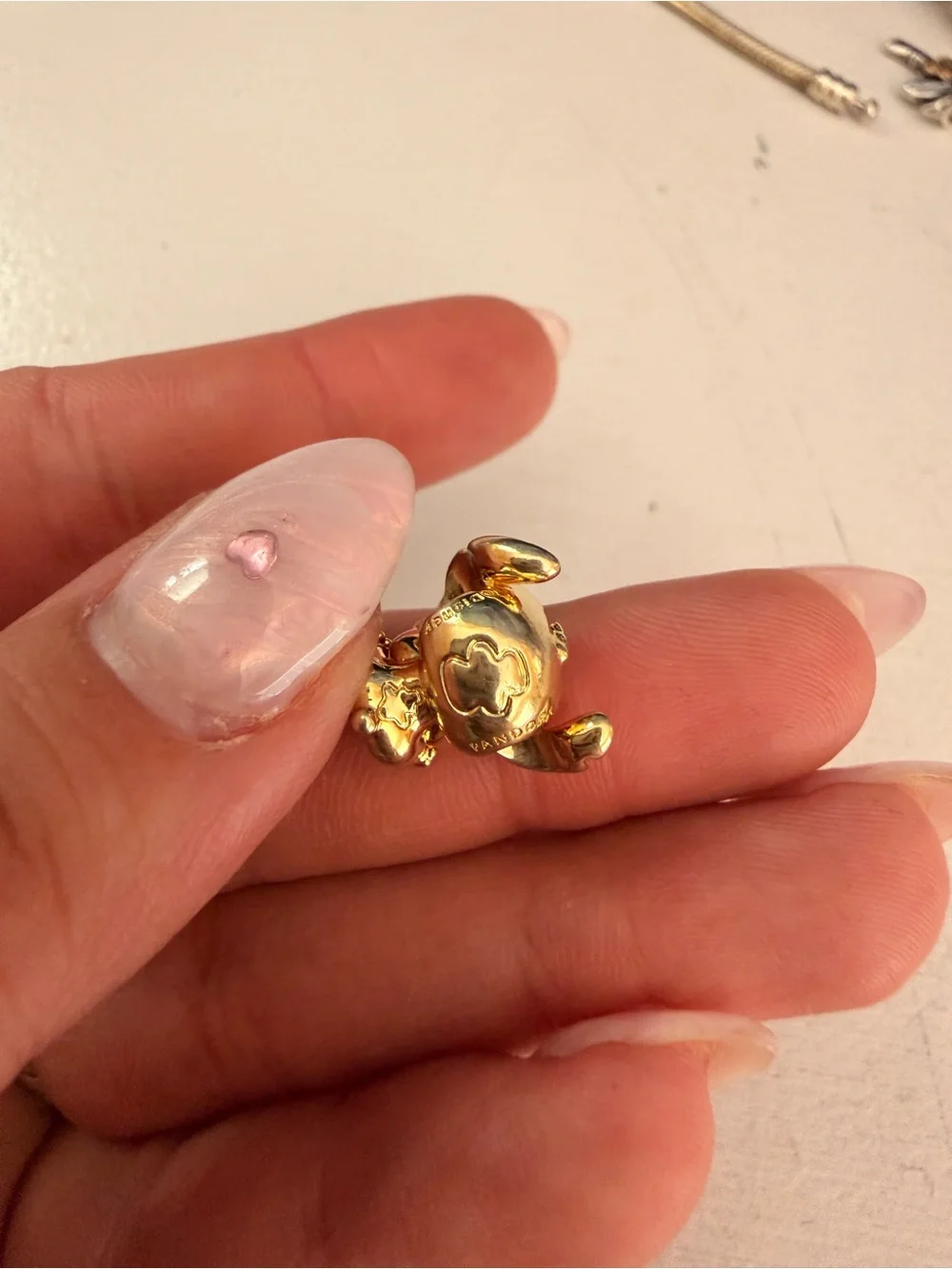 Pandora Gold Stitch Charm with Red Accent